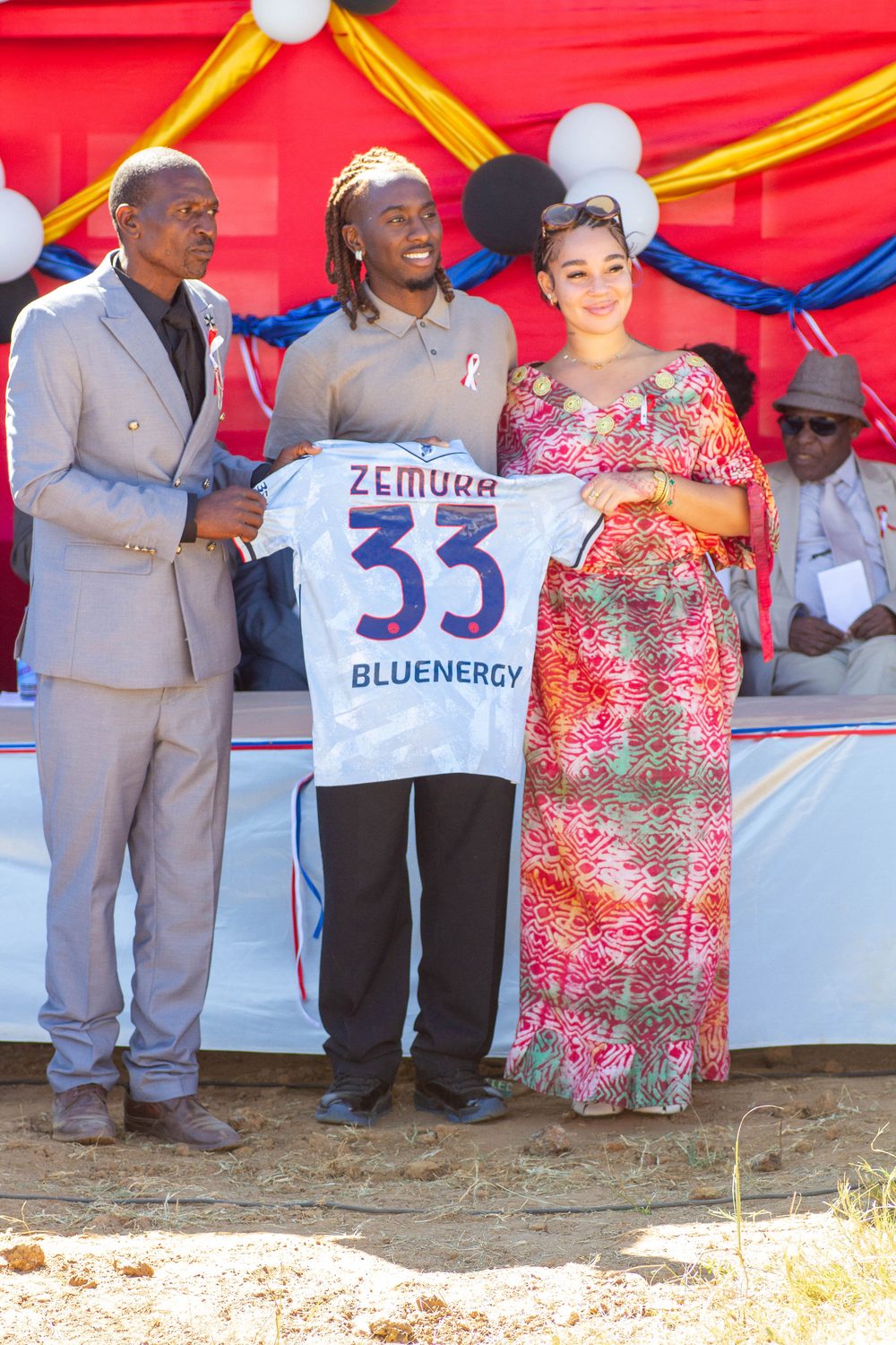 A Zemura 33 shirt presented at a community event