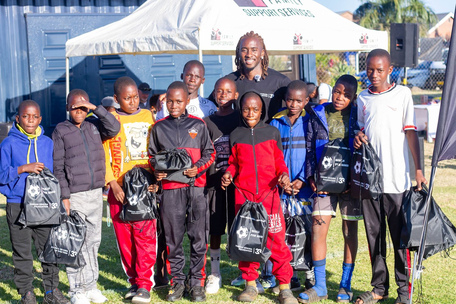 Young people receiving support packs